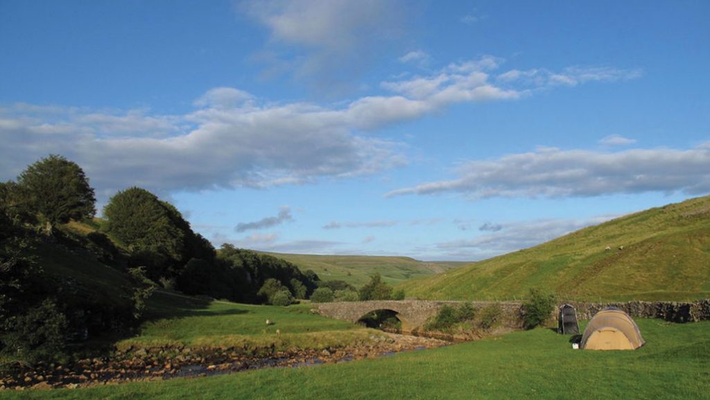 Camping outdoors in a field