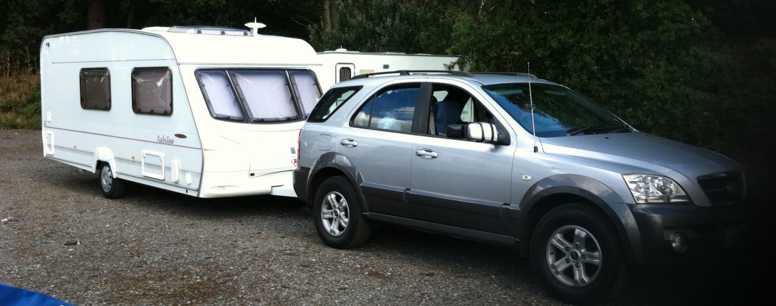Kia towing a caravan